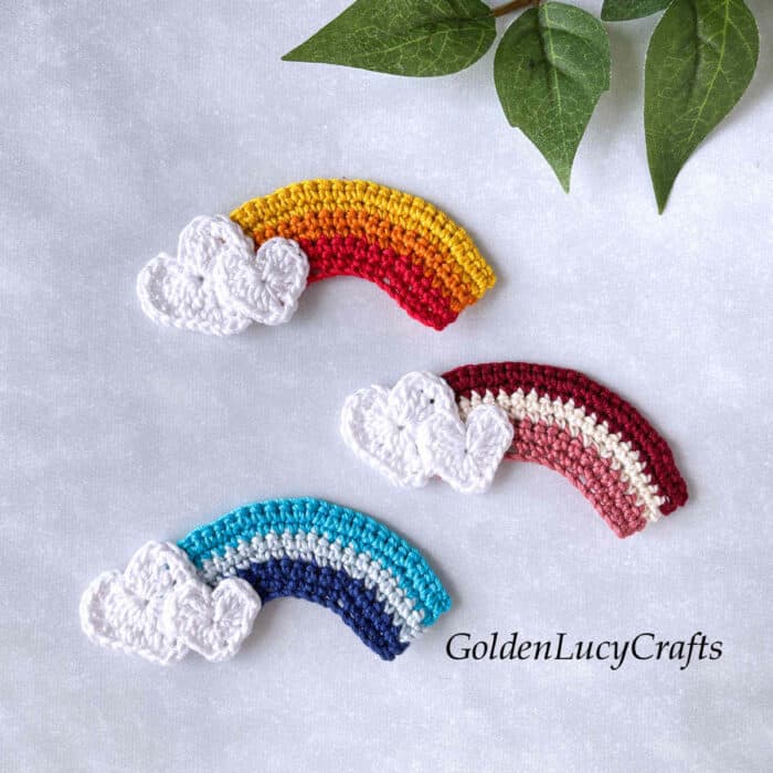 Three crochet appliques - rainbow with hearts for the cloud.