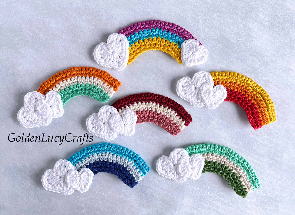 Crochet rainbow appliques with heart clouds.