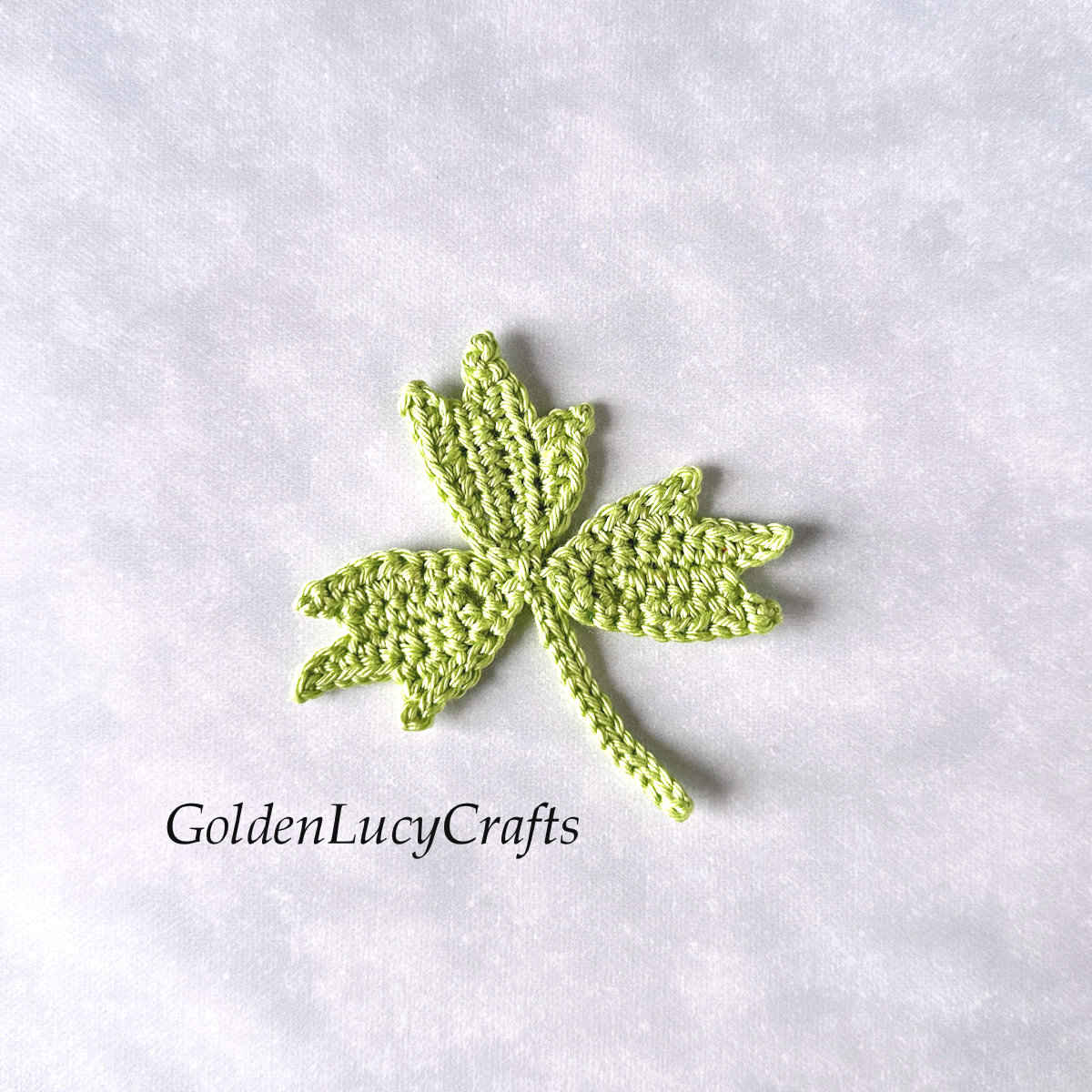 Crocheted pale green leaf.