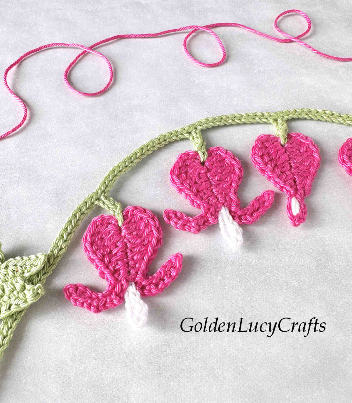 Crochet bleeding heart applique close-up picture.