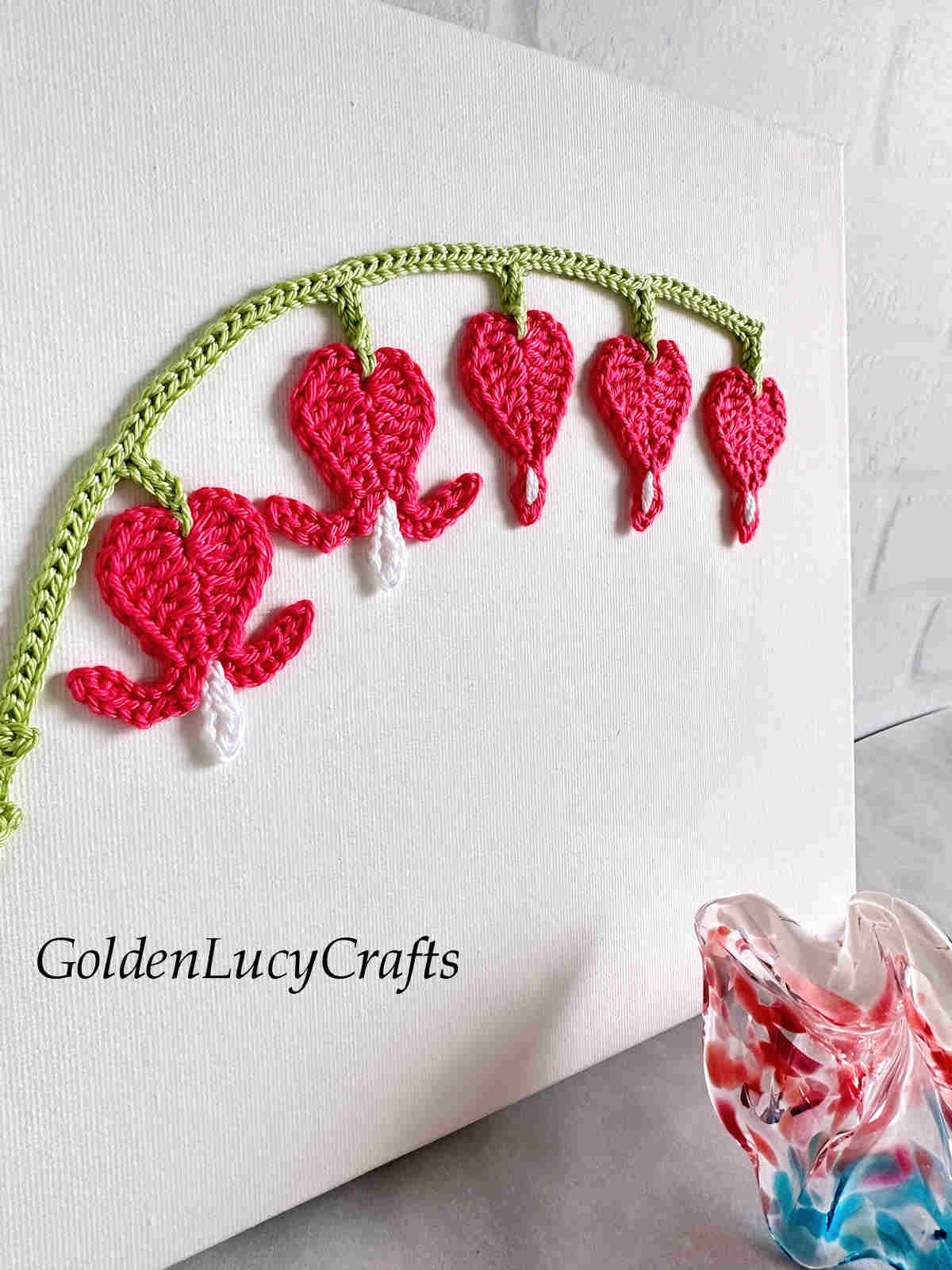 Bleeding heart crochet wall art close-up picture.