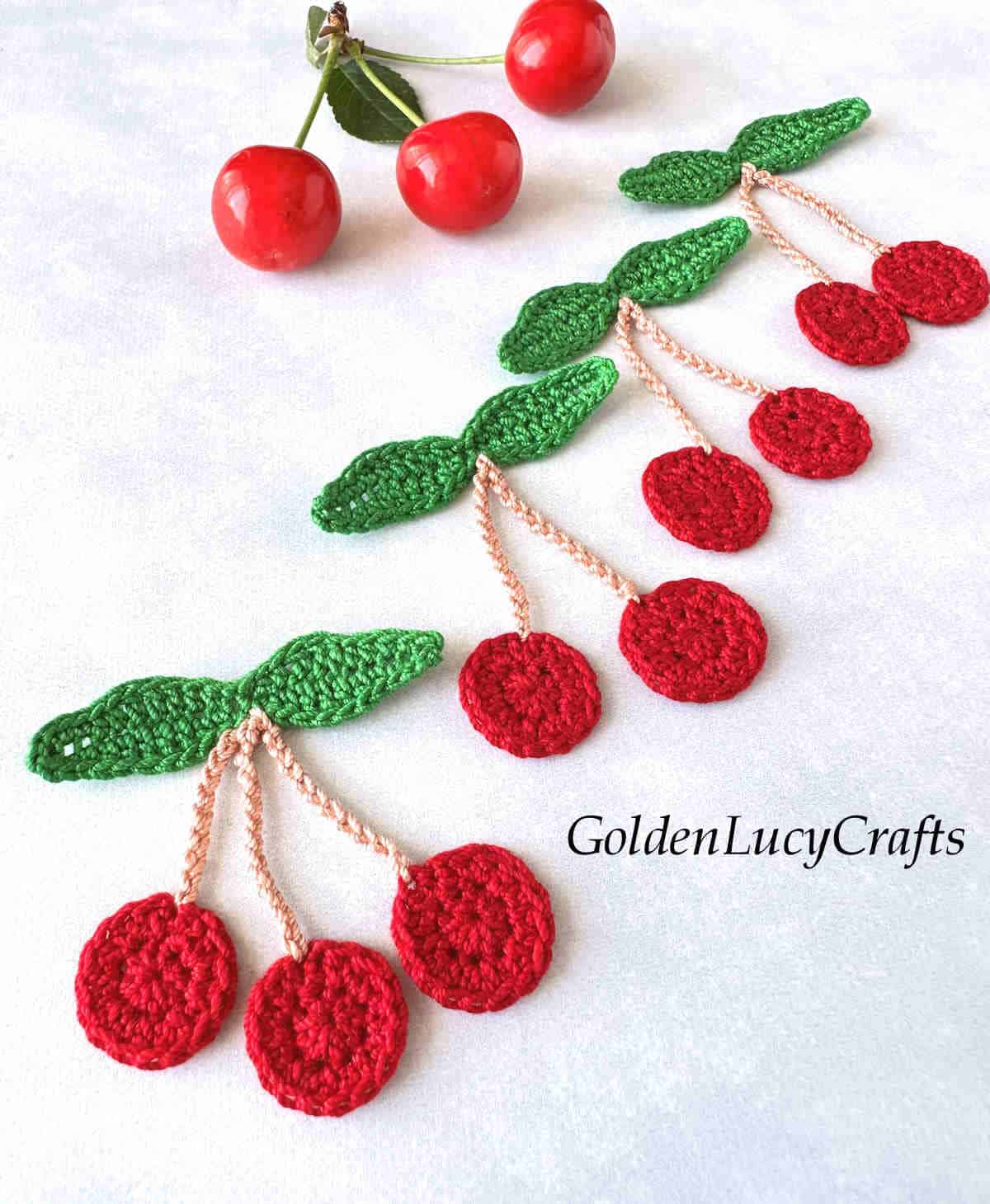 Crocheted cherry appliques.