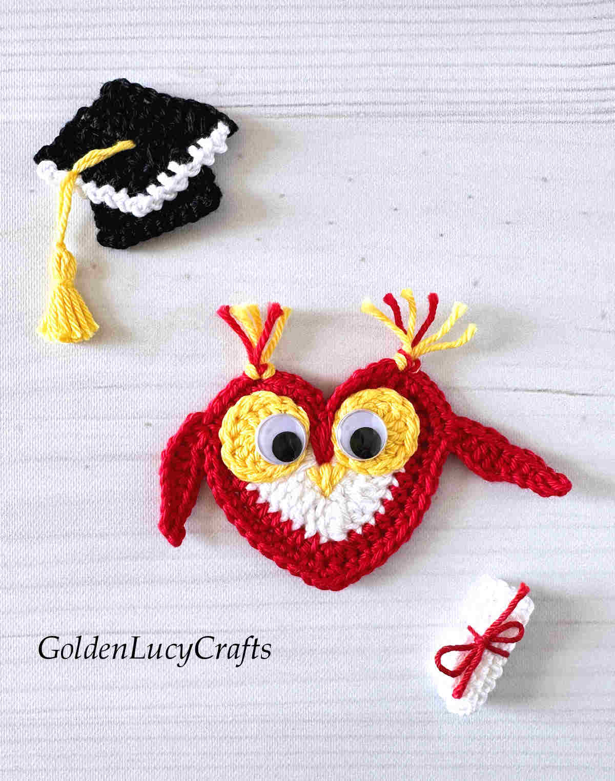 Crocheted graduation cap, owl and diploma appliques.