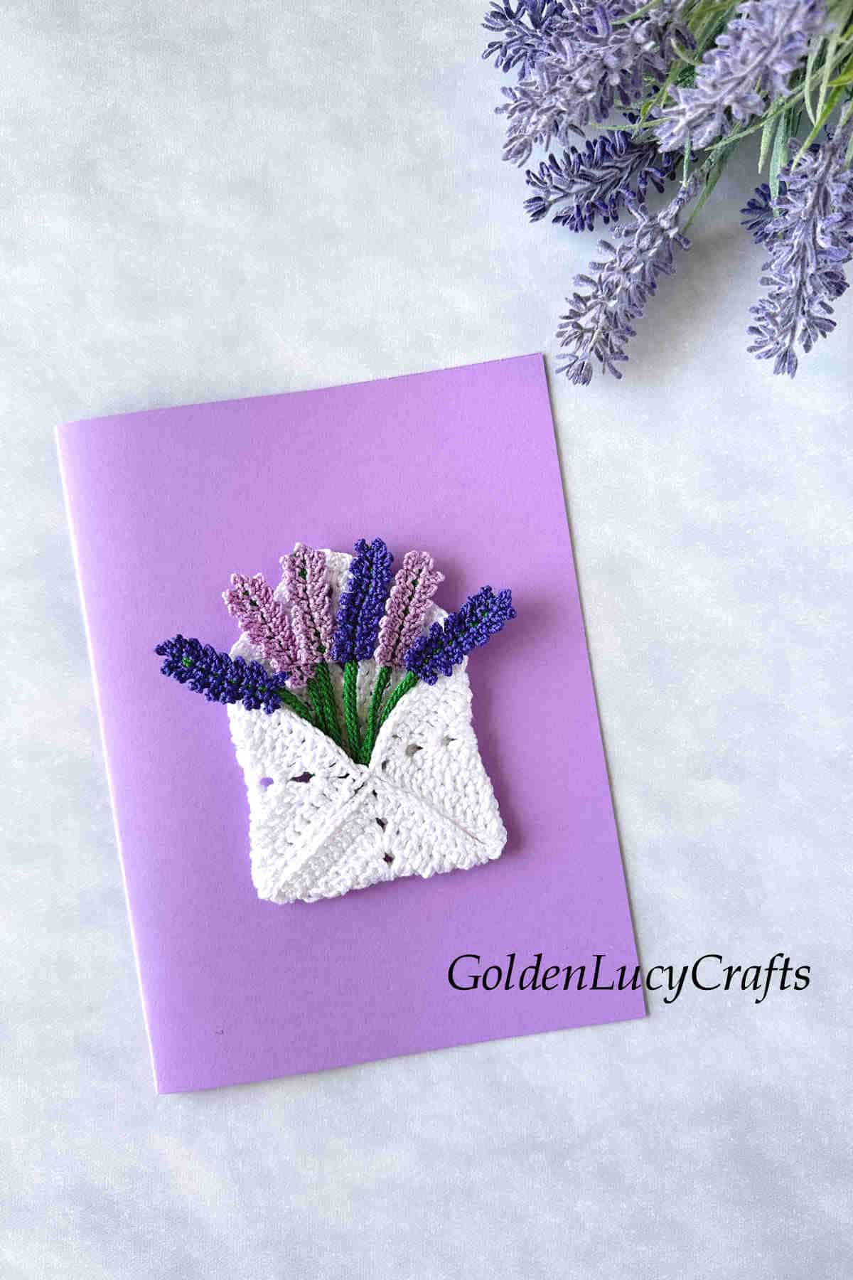 Handmade card with crochet lavender envelope applique on it.