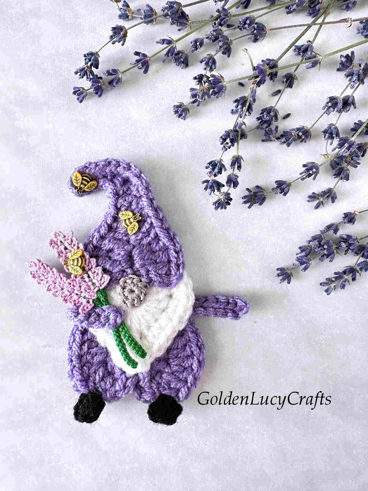 Crochet heart gnome with lavender embellished with bee buttons.