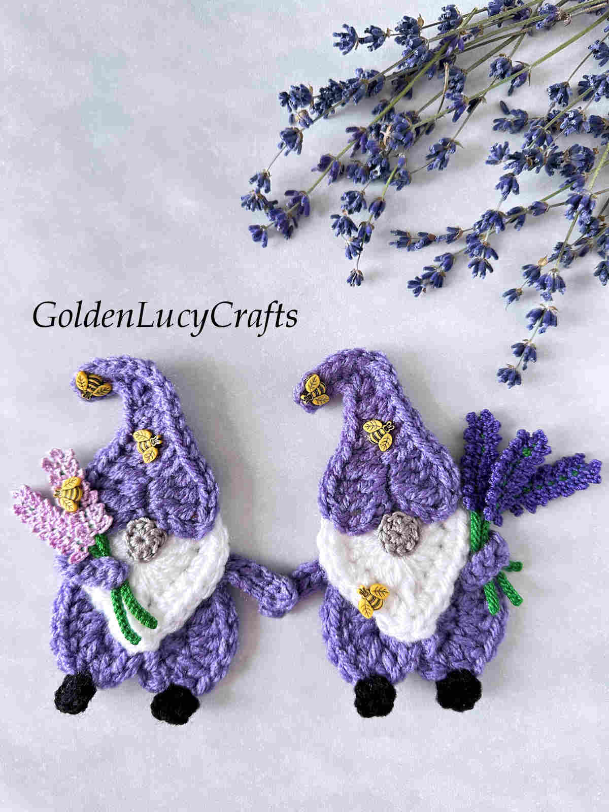 Two lavender gnomes crochet appliques.