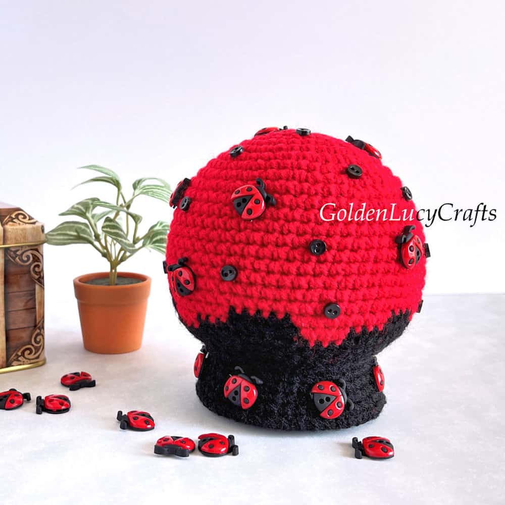 Crochet snow globe amigurumi made in ladybug theme.