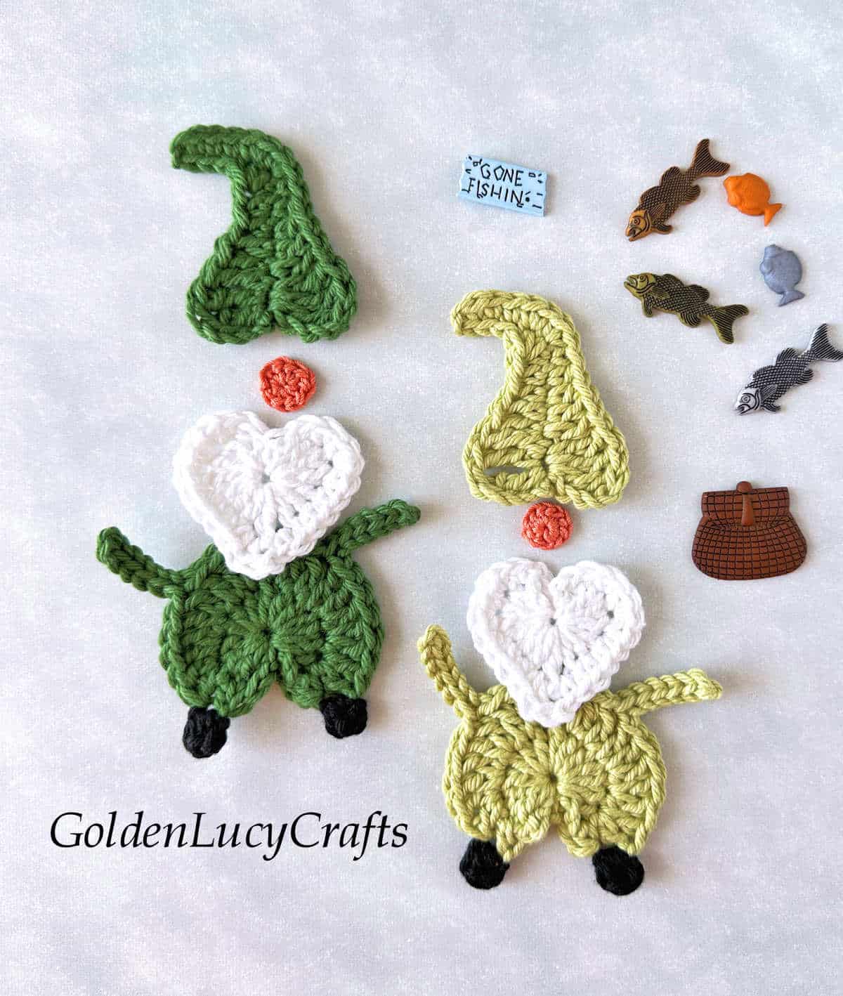 Parts of crochet gnomes and fishing themed craft buttons.