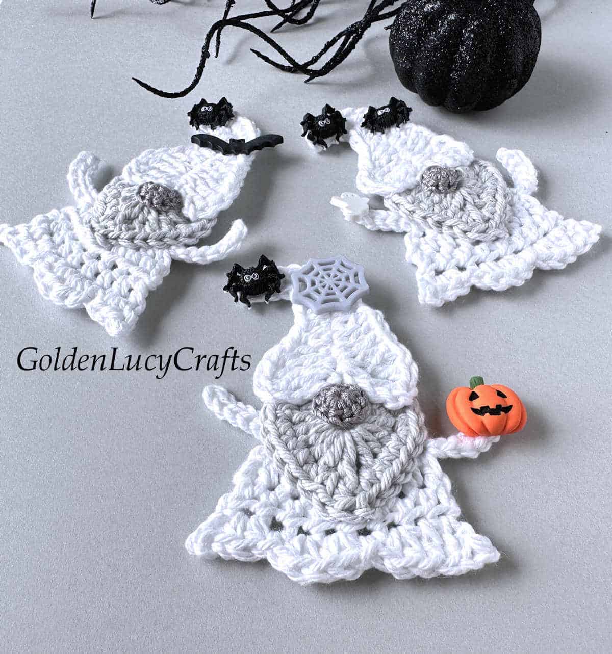 Three crochet Halloween ghost gnomes.
