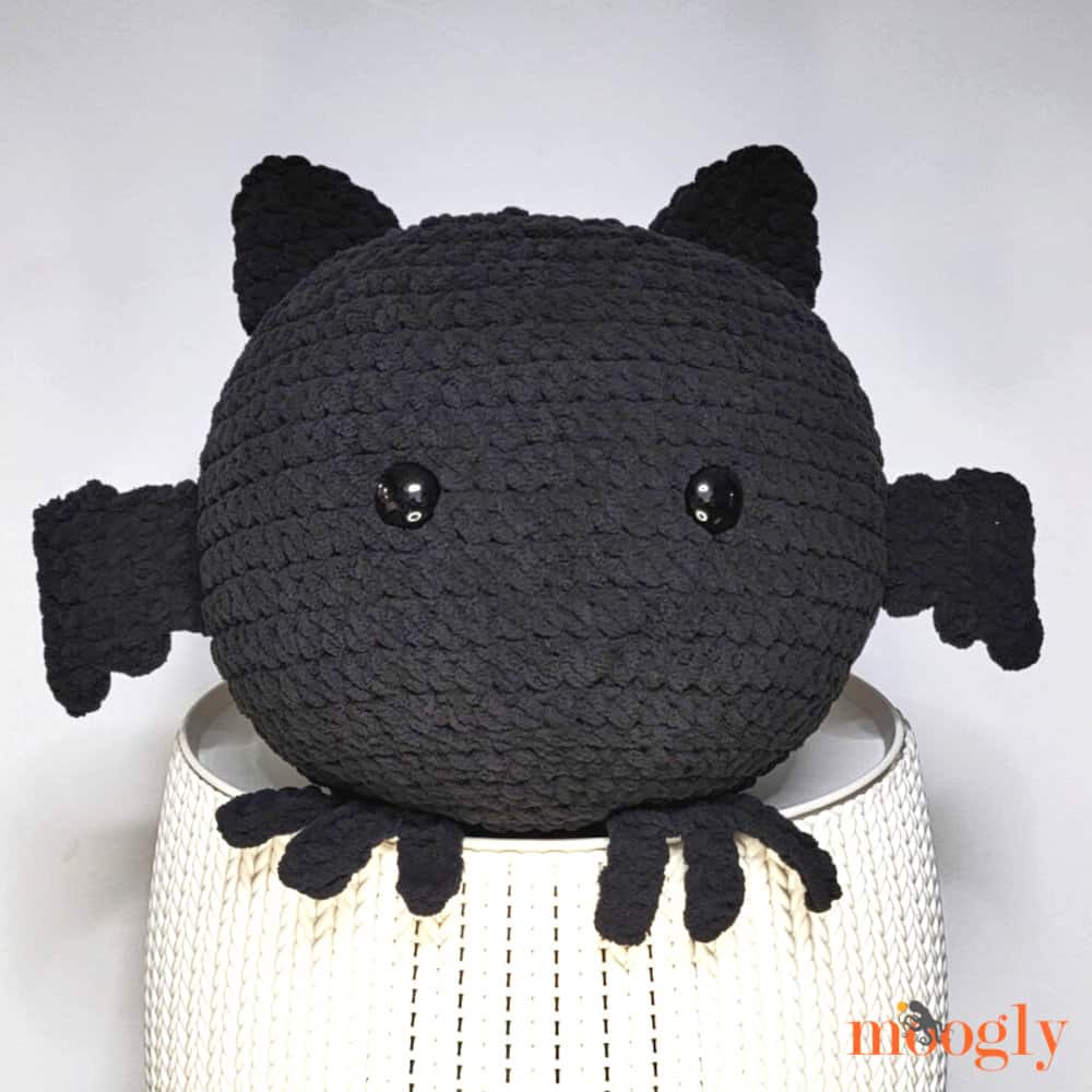 Large crocheted black bat toy.