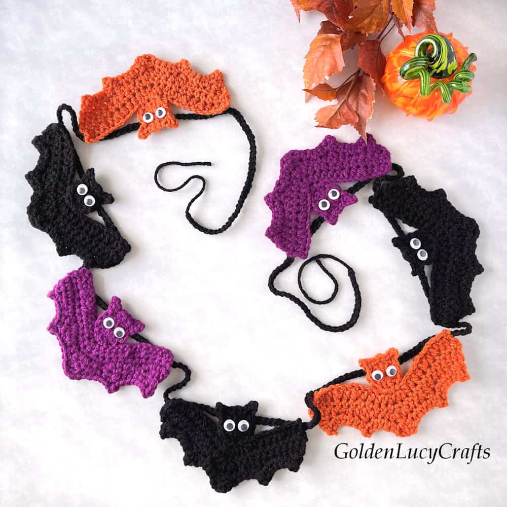 Crocheted bat garland for Halloween.