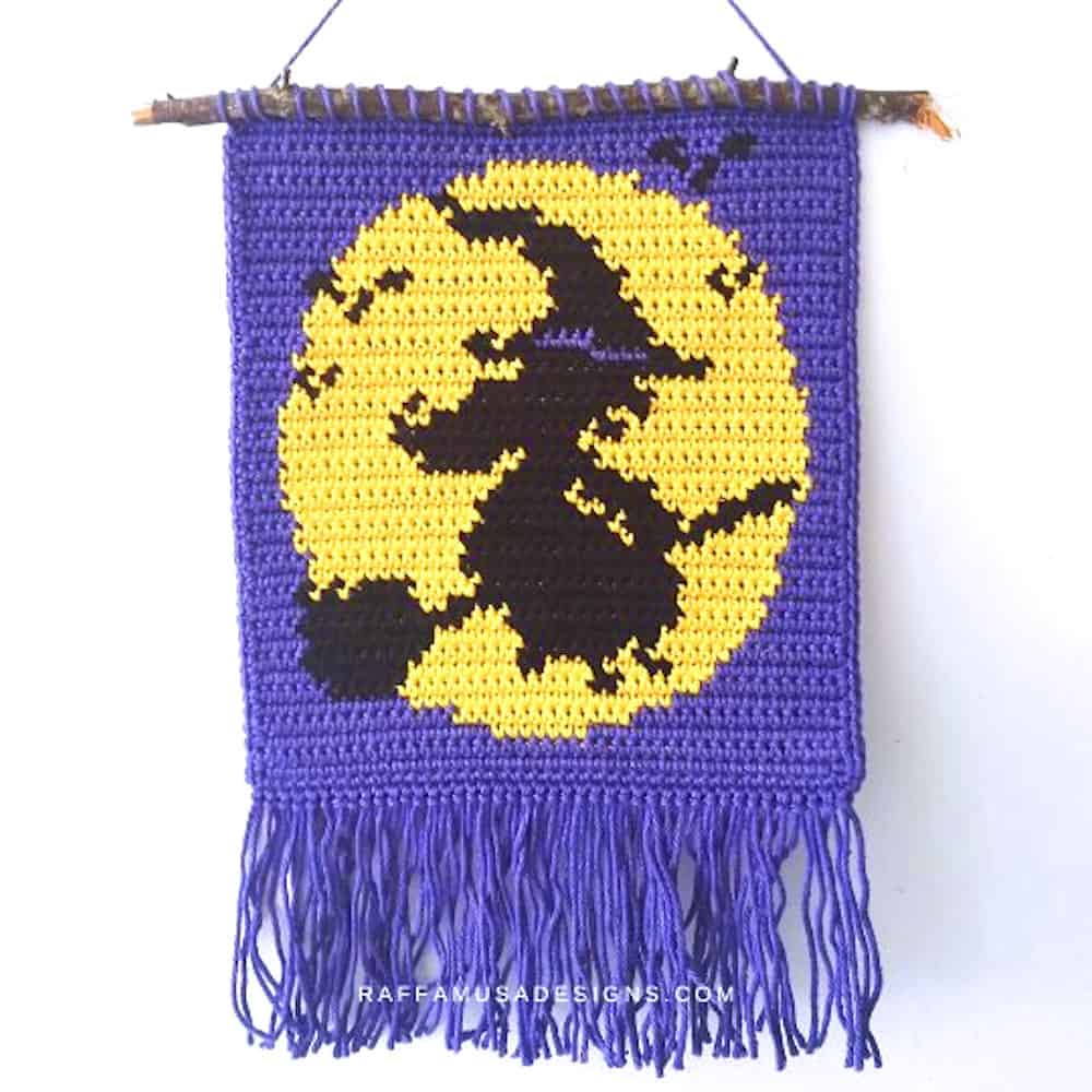 Crochet wall hanging flying witch.