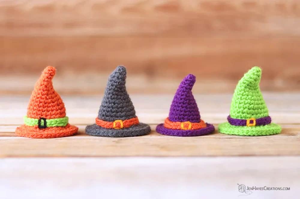 Four crocheted witch hats.
