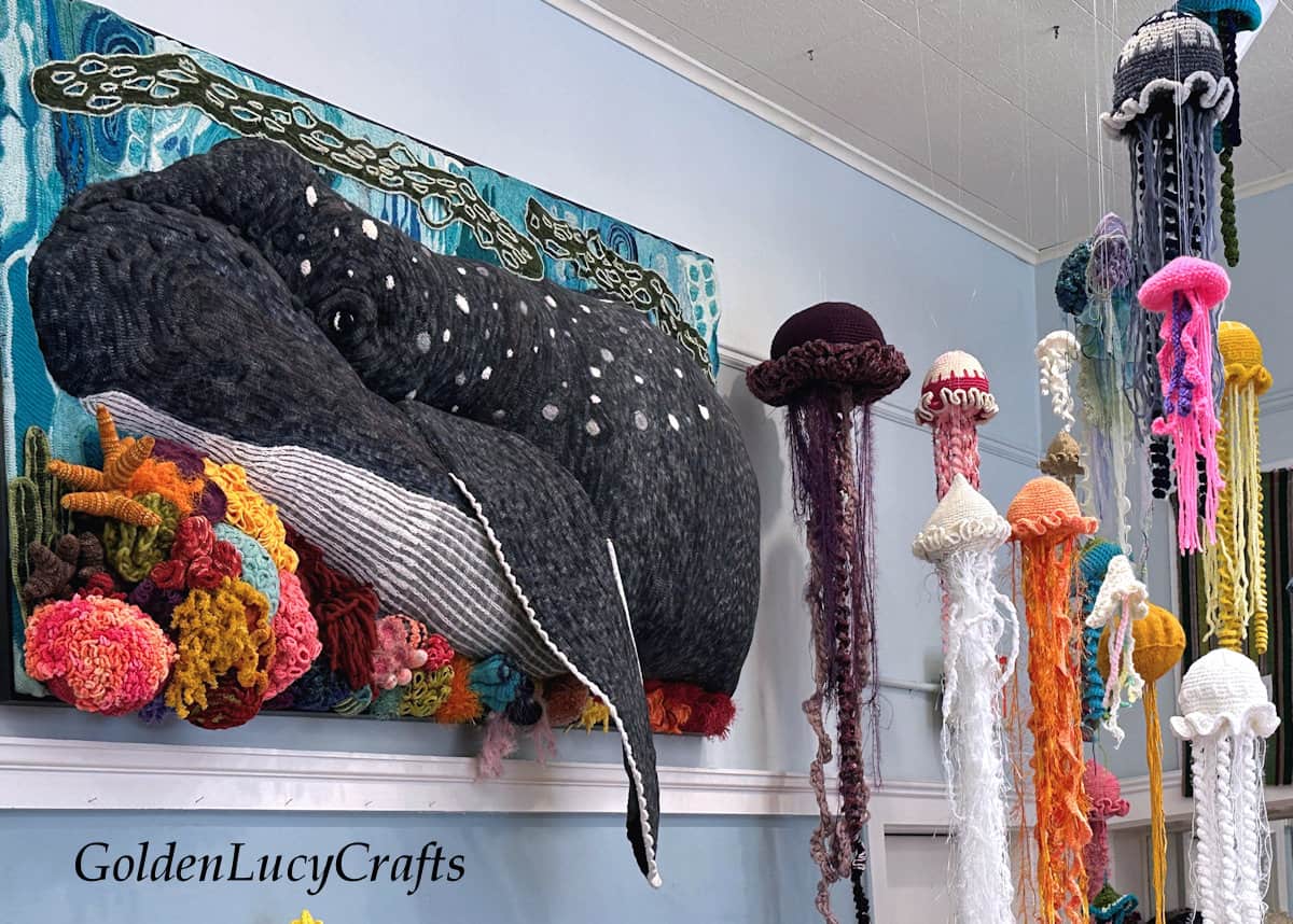 Large whale, corals and jellyfish made of yarn.