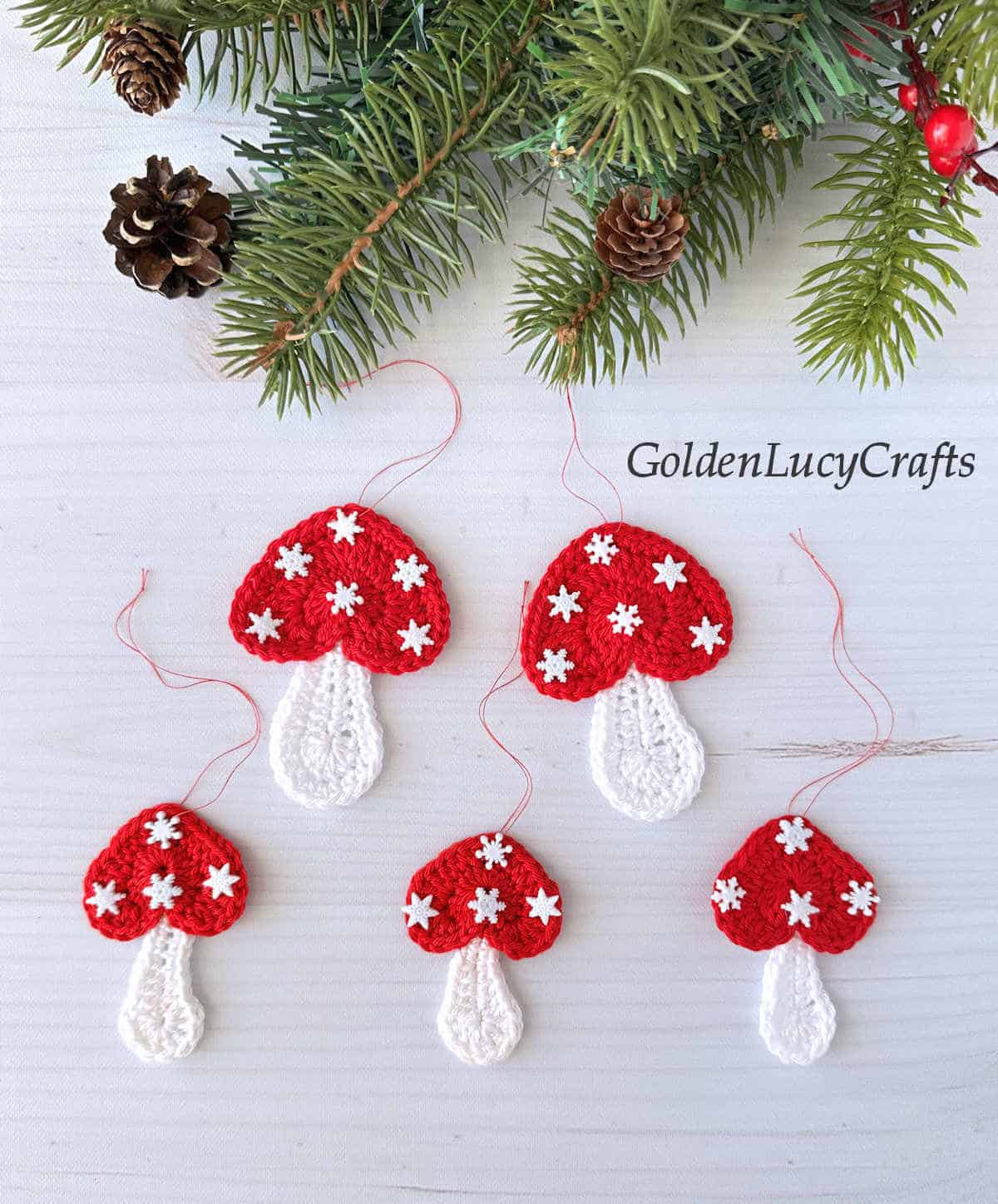 Crocheted mushrooms with heart-shaped caps Christmas ornaments.