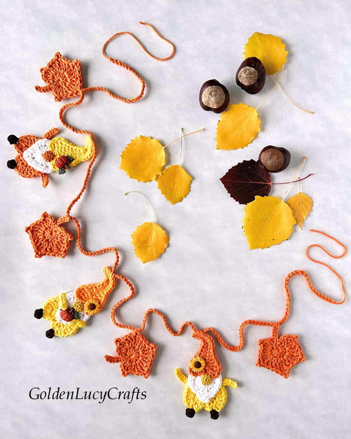 Crocheted Fall themed garland, yellow leaves and chestnuts.