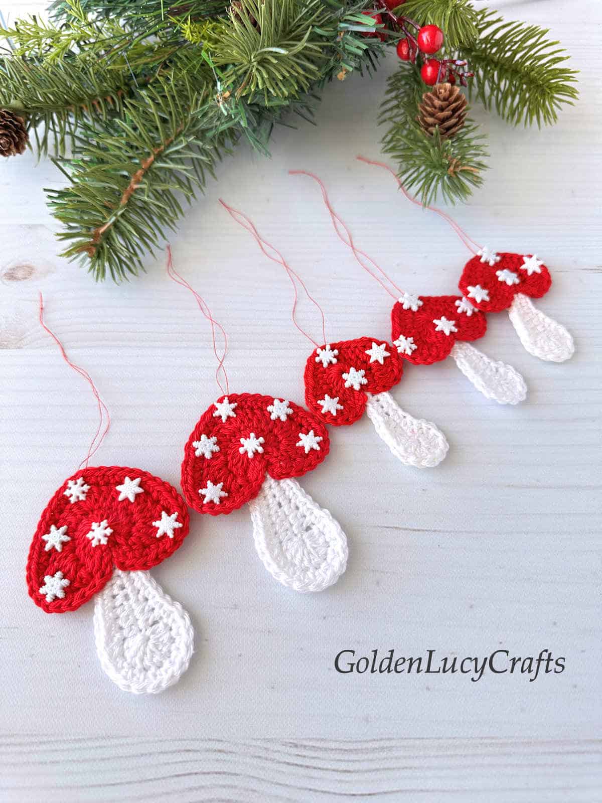 Five crocheted mushroom ornaments.