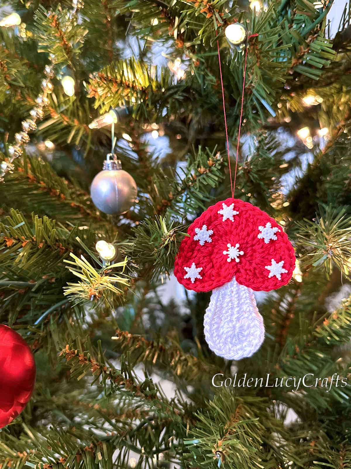 Crochet mushroom ornament on the Christmas tree.