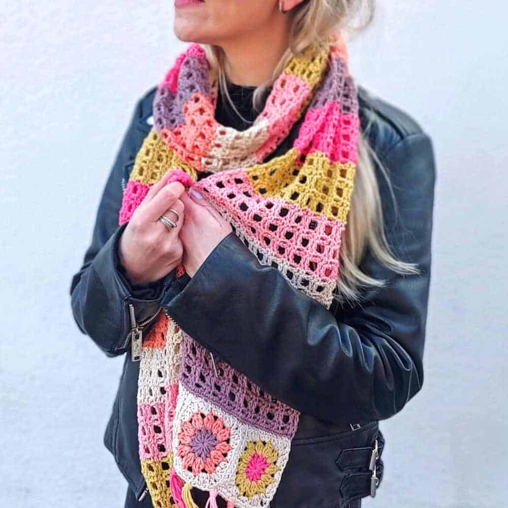 Model dressed in crocheted scarf.