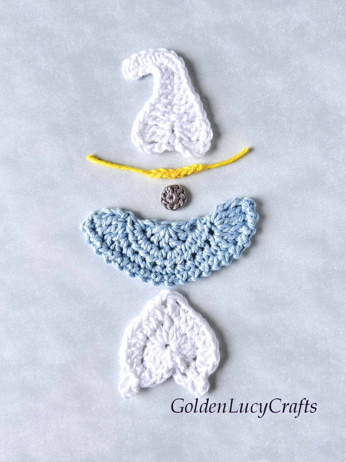 Parts of crocheted angel gnome.