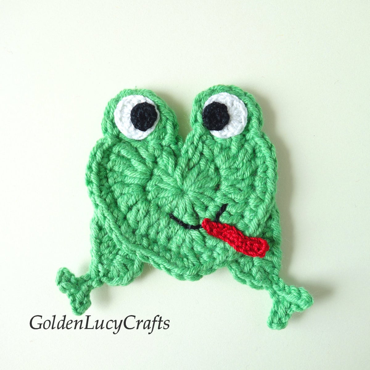Crochet frog applique.