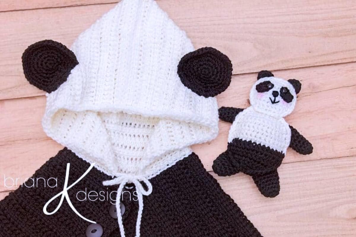 Crocheted panda poncho and panda toy.