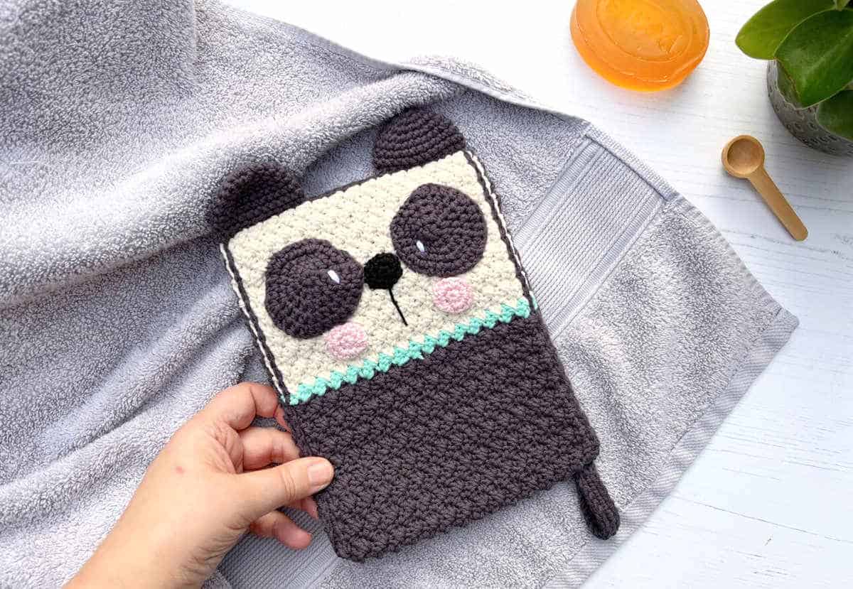 Crochet panda-themed washcloth.