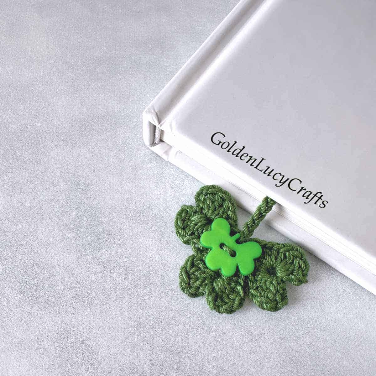 Book with crocheted shamrock bookmark in it.