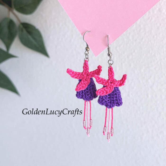 Crochet fuchsia flower earrings.