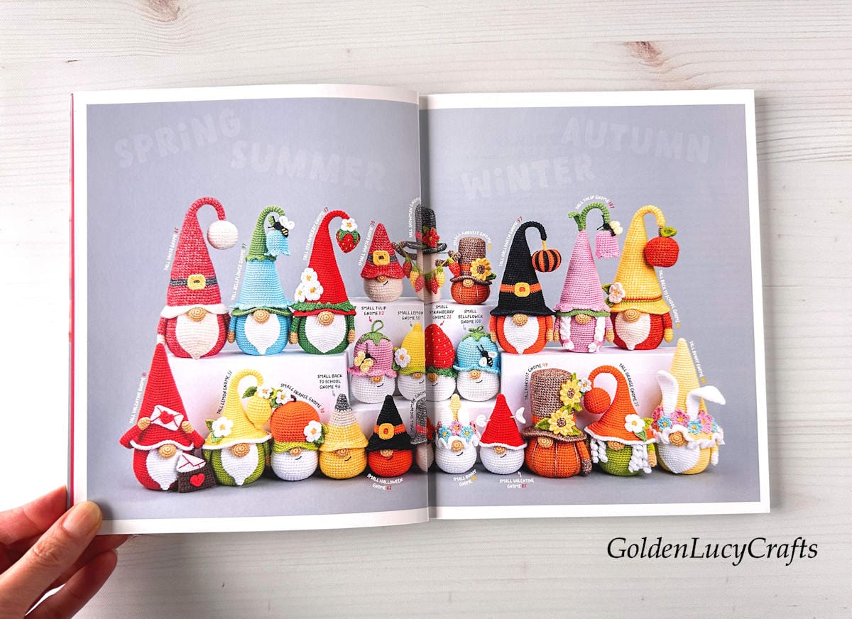 An open book Amigurumi Gnomes on a light wooden background.