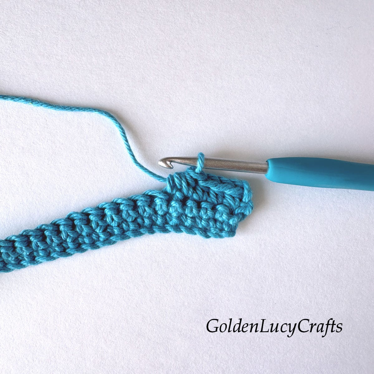 Crochet sample demonstrating stitch half double crochet 2 stitches together.