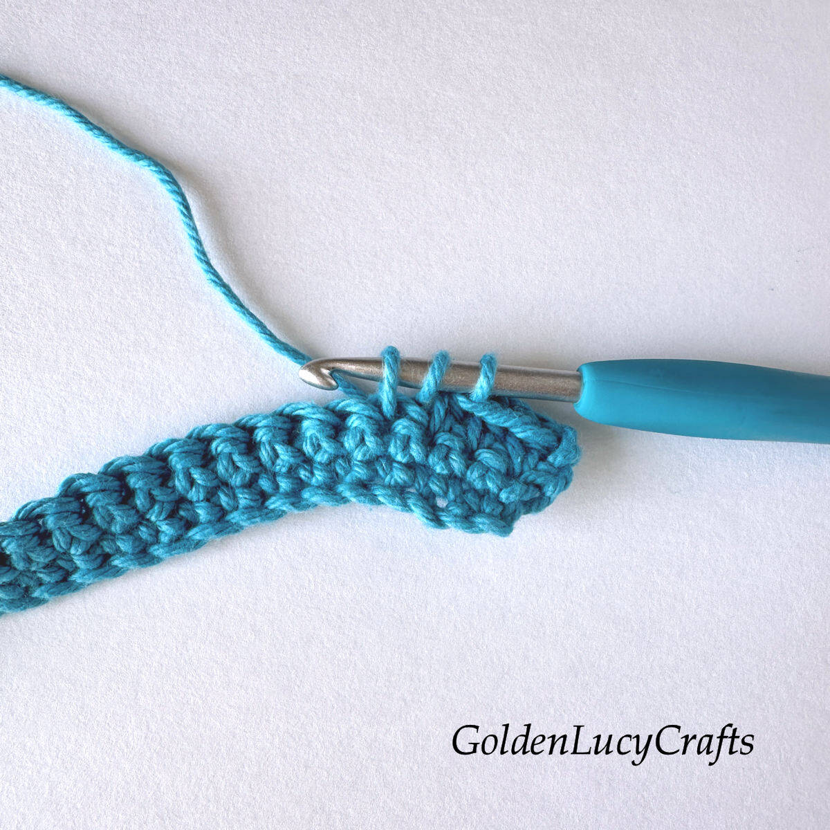 Crochet sample demonstrating Step 3 of how to work half double crochet 2 stitches together.