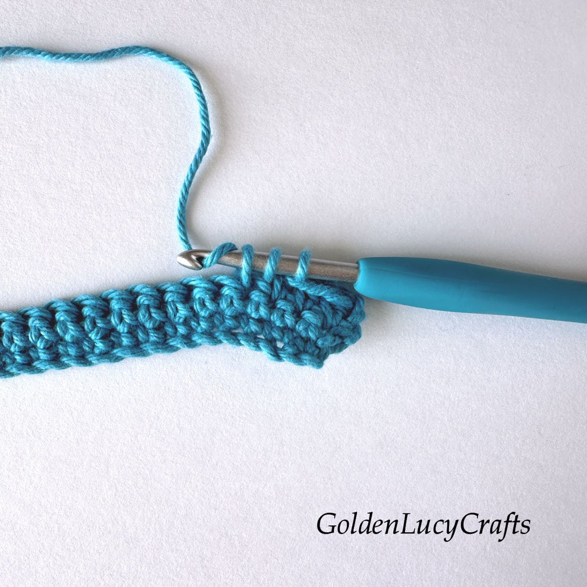 Crochet sample demonstrating Step 4 of how to work half double crochet 2 stitches together.