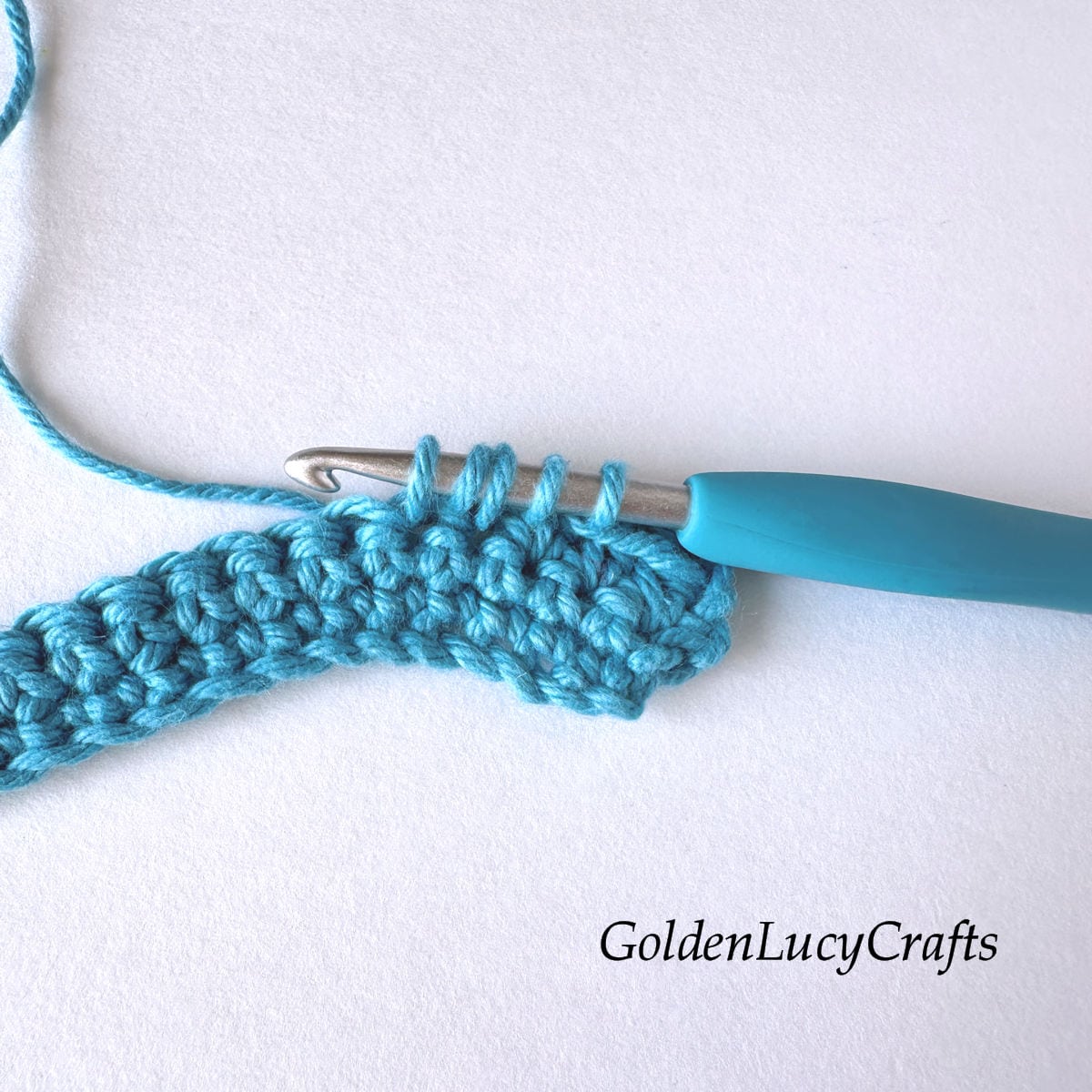 Crochet sample demonstrating Step 6 of how to work half double crochet decrease.
