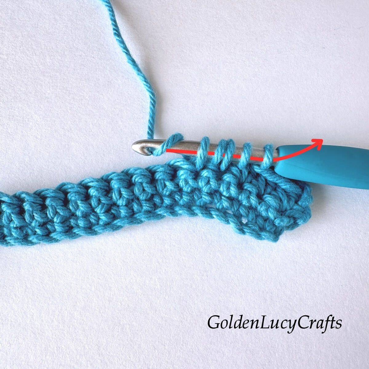 Crochet sample demonstrating Step 7 of how to work half double crochet 2 stitches together.