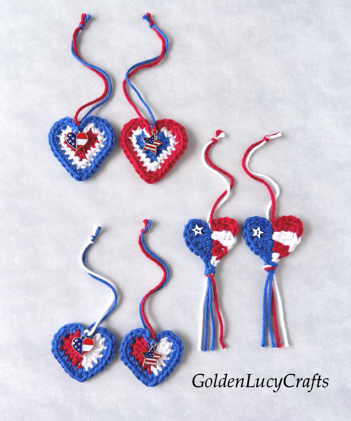 A variety of crocheted hearts in red, white, and blue colors for the 4th of July.