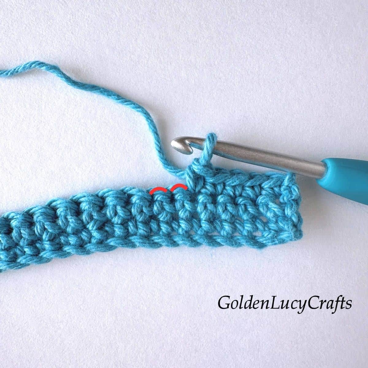 Crochet sample demonstrating step 1 of how to crochet an invisible decrease.