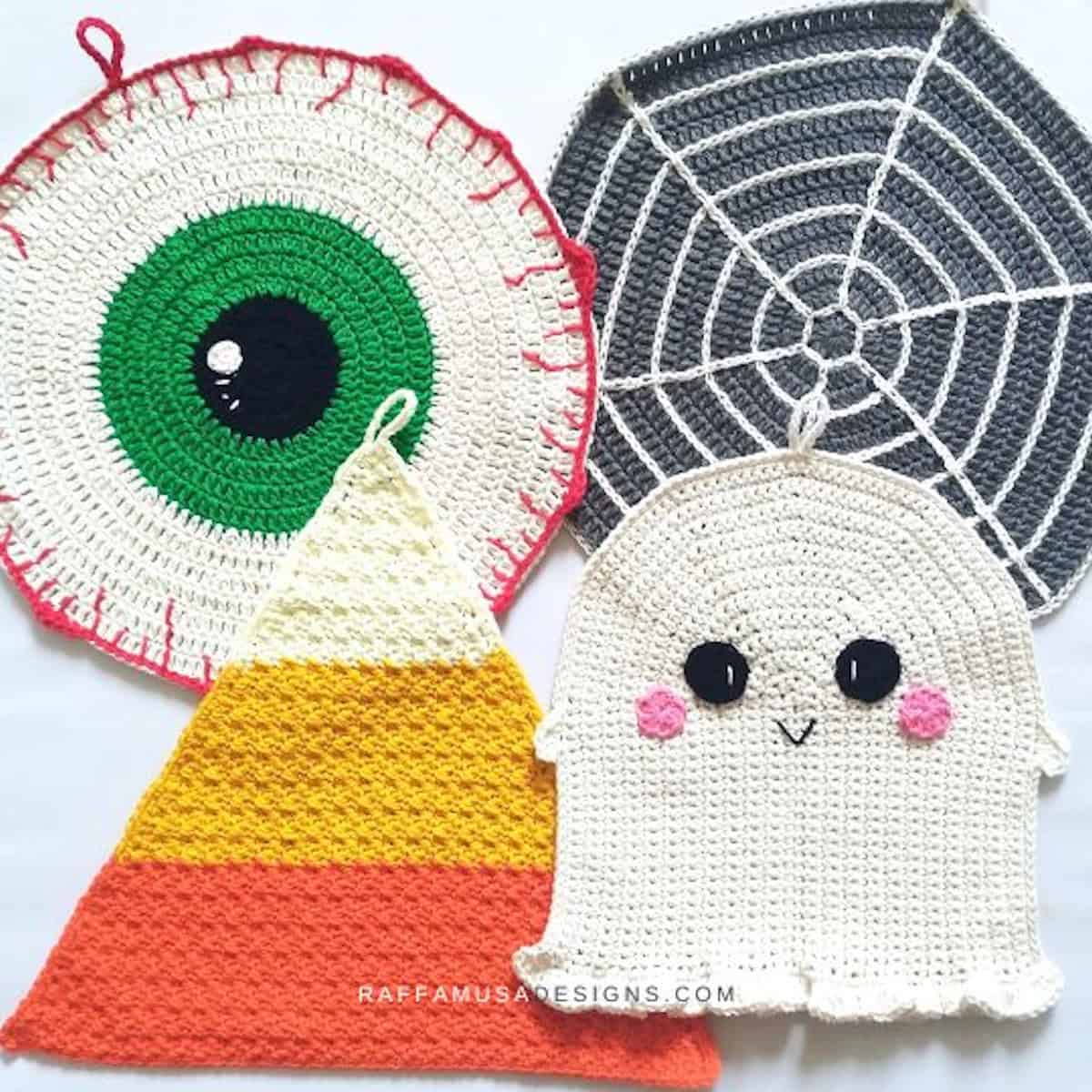 Crocheted Halloween-themed dishcloths.