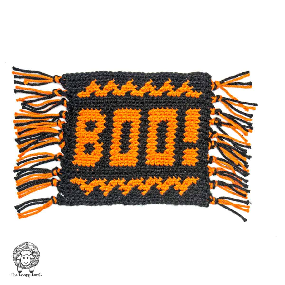 Crocheted Halloween mug rug with word boo on it.