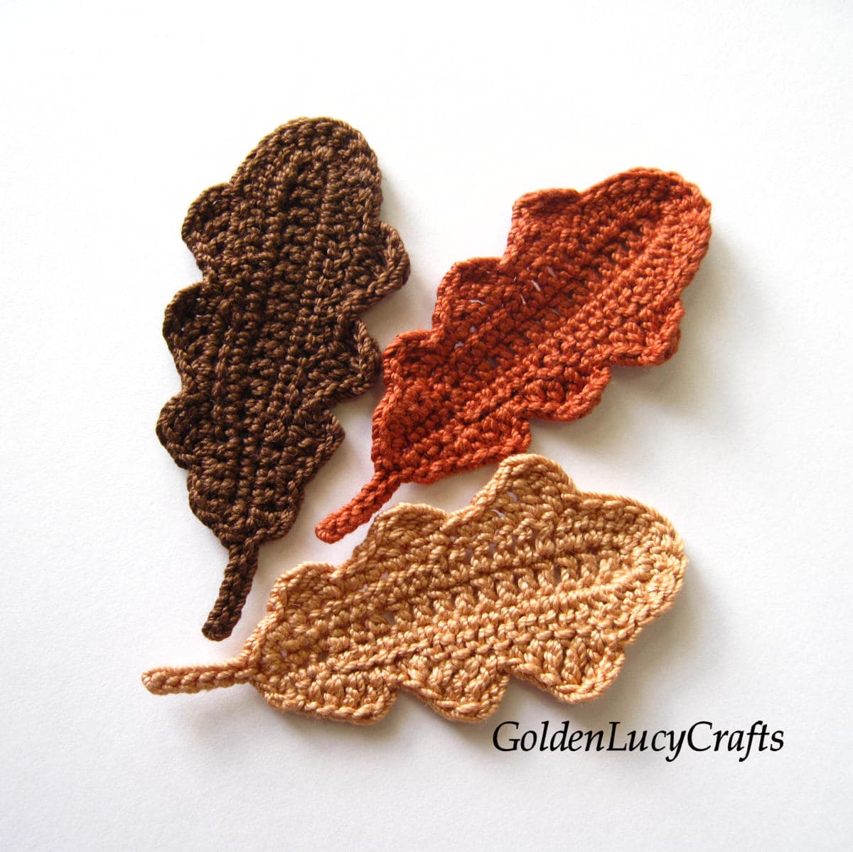 Three crocheted oak leaves.