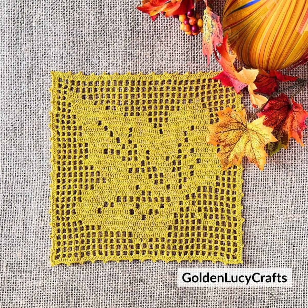 Filet crochet yellow maple leaf.